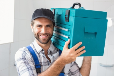 A professional with a toolkit ready to redesign a man cave for a house in Maryland