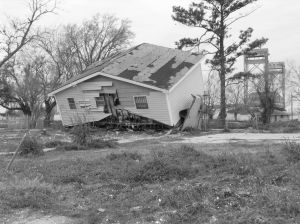 Black and white image of damaged house due to flooding