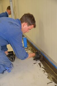 Contractor Installing Concrete Sealant