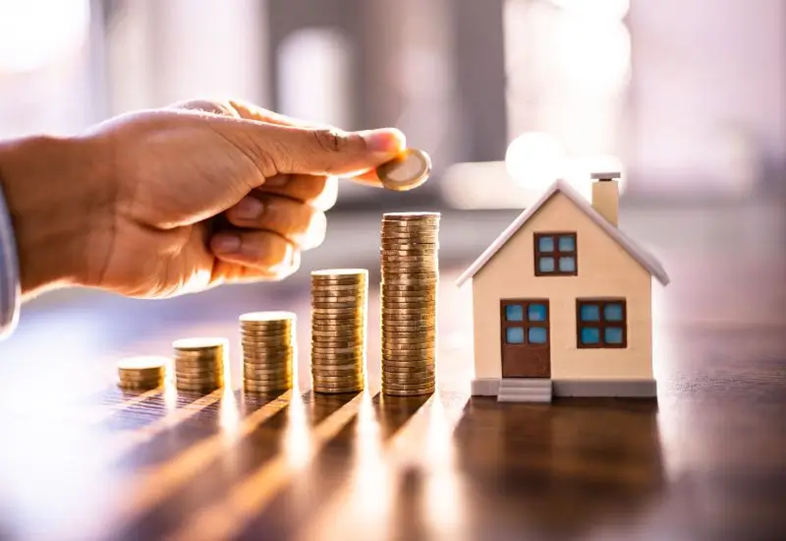 Money next to a house indicating an increase in property value