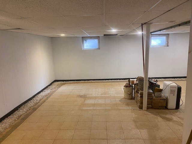 Finished basement with interior perimeter drain system.