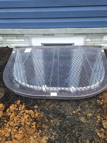 Newly installed basement egress window well