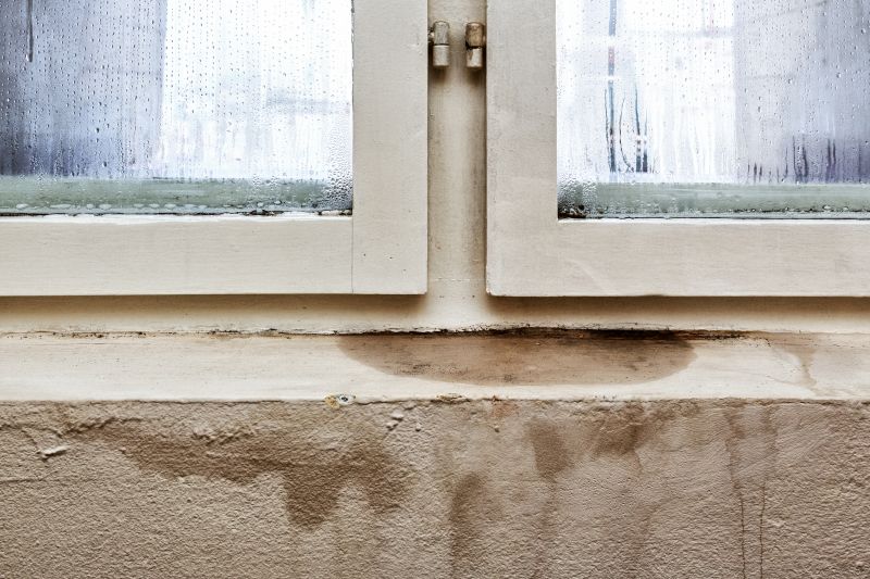 Condensation and water stains on basement window causing leakage issues